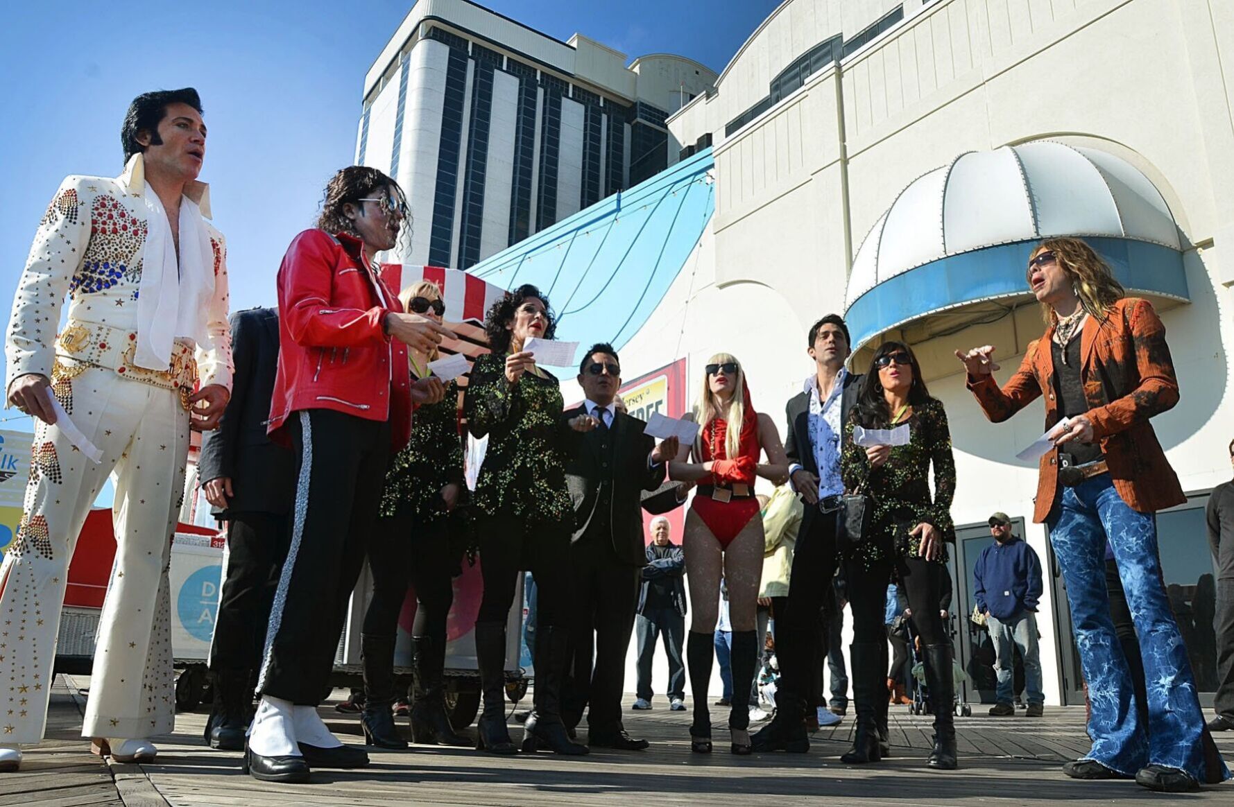 Cast members of Legends in Concert at Bally's sing "On The Boardwalk" before the walk. Sunday November 11 2012 The AC Boardwalk Walk. (The Press of Atlantic City / Ben Fogletto)